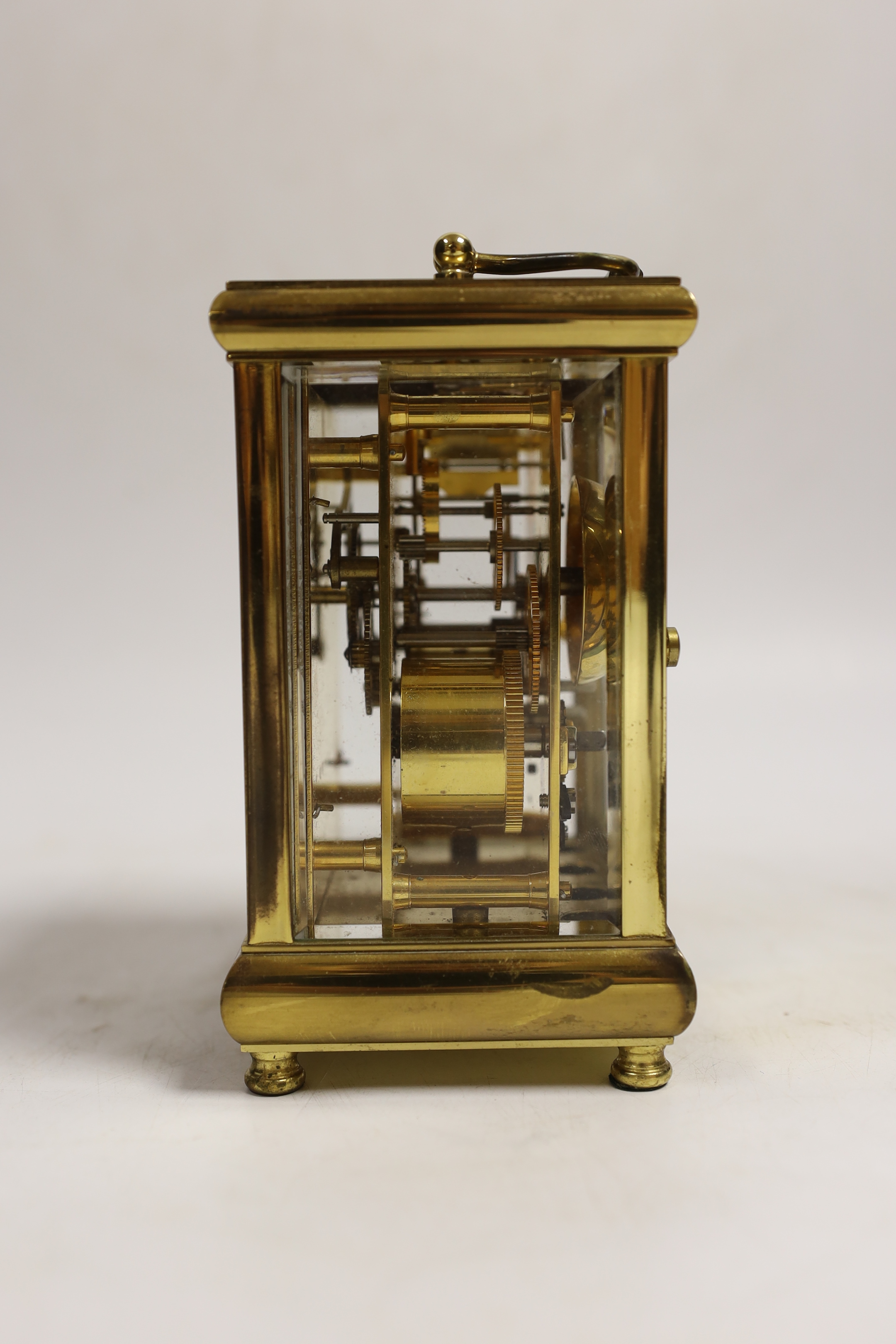 A 20th century brass carriage clock, signed Taylor and Bligh, England, striking on a bell 14cm high